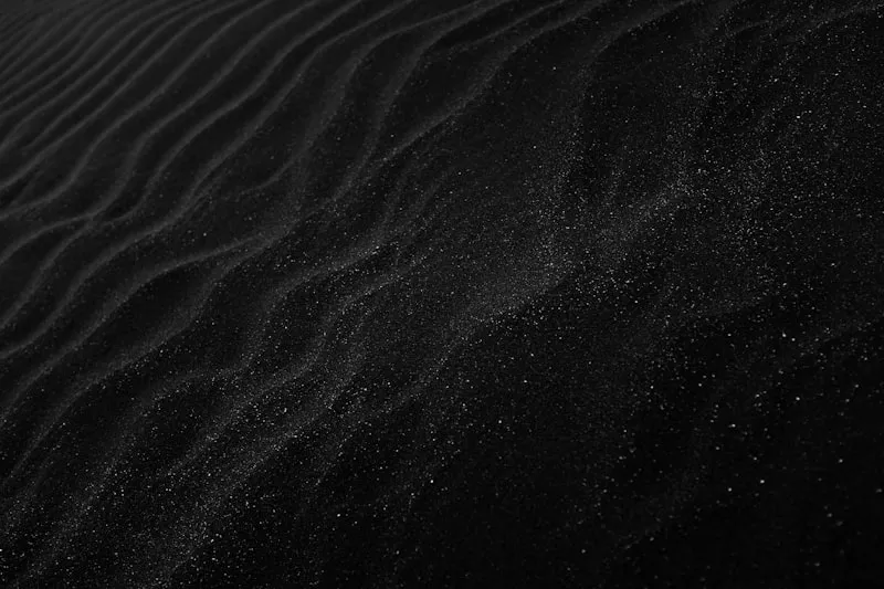 Dice scattered on a dark surface representing chance and probability